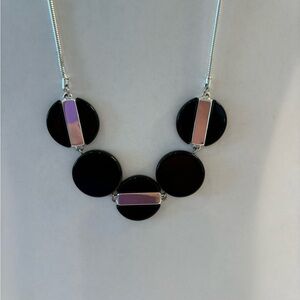 Silver and black necklace.